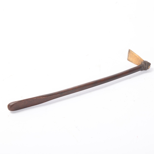 819 - A South Seas Tribal tattoo hammer, bone and wood with rope binding, length 24cm