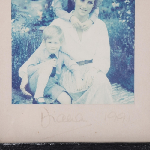 700 - Diana, Princess of Wales, photograph portrait of Diana with Princes William and Harry, signed in pen... 