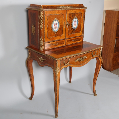 703 - An ornate French kingwood and rosewood writing desk, circa 1900, the upper part fitted with 2 doors ... 