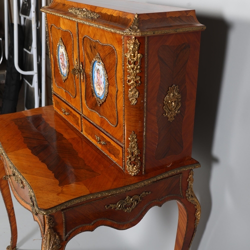 703 - An ornate French kingwood and rosewood writing desk, circa 1900, the upper part fitted with 2 doors ... 