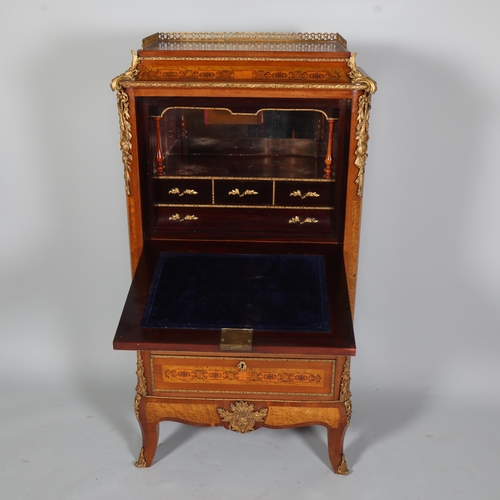 705 - An ornate French mahogany and marquetry inlaid writing cabinet, circa 1900, brass galleried top with... 