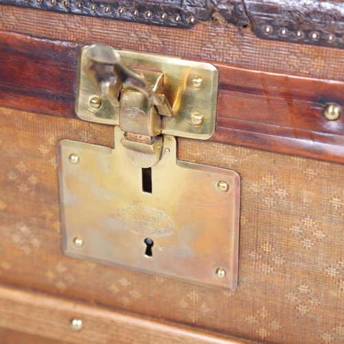 707 - A Vintage French travelling trunk, brass wood and leather-bound with canvas panels, original label i... 