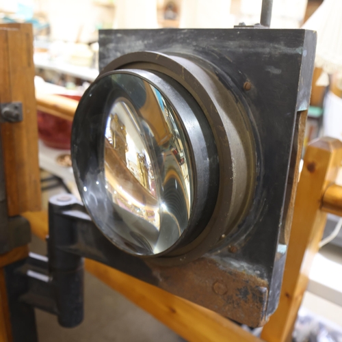 718 - A large Victorian floor standing studio camera, mahogany and brass, with inter-changeable plate size... 