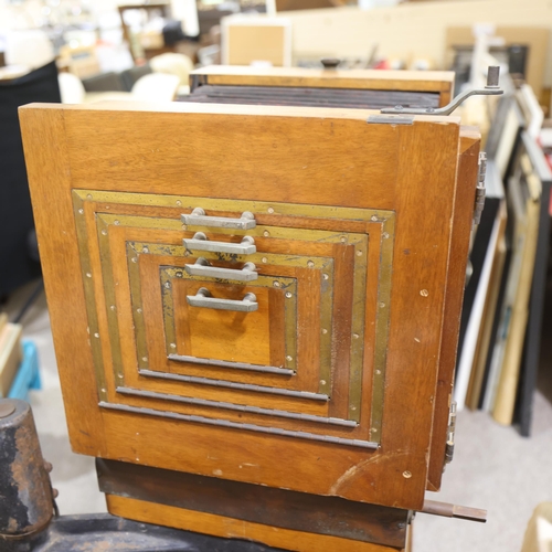 718 - A large Victorian floor standing studio camera, mahogany and brass, with inter-changeable plate size... 