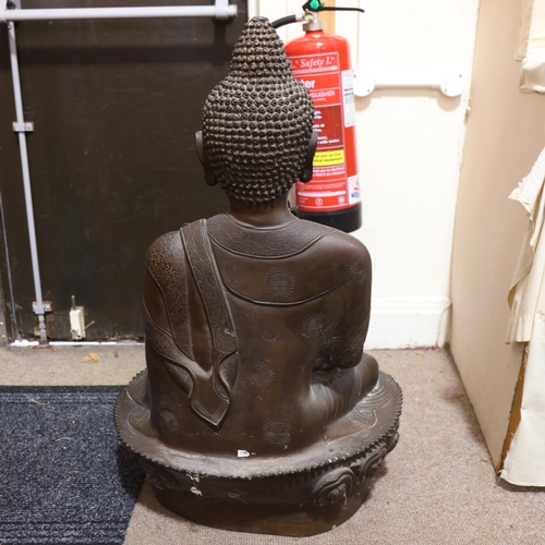 803 - A large Chinese patinated bronze seated Buddha, resting on lotus design base, height 85cm