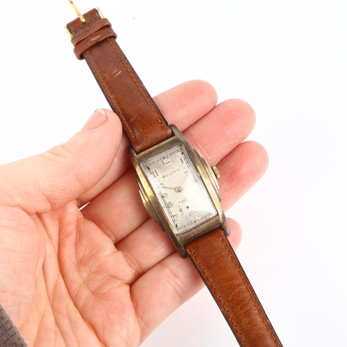 2044 - BULOVA - an American gold plated stainless steel mechanical wristwatch, circa 1940s, silvered dial w... 