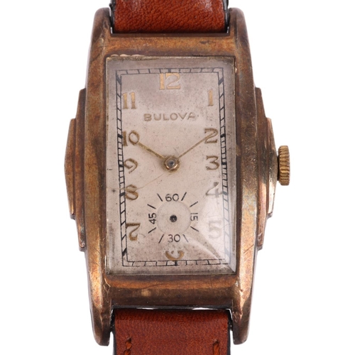 2044 - BULOVA - an American gold plated stainless steel mechanical wristwatch, circa 1940s, silvered dial w... 