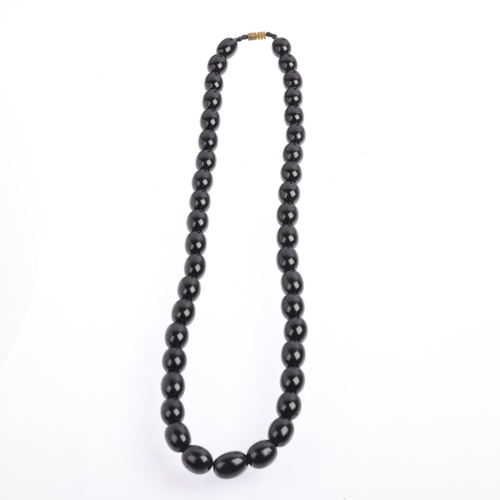 2523 - A single-strand graduated jet bead necklace, beads measure 14.2-10mm, 49cm, 37.2g