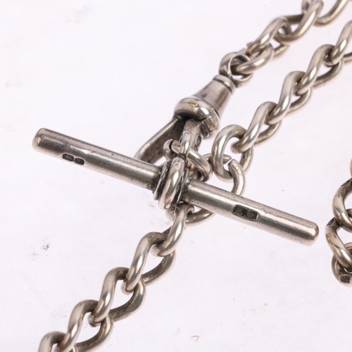 2524 - An early 20th century silver solid curb link Albert chain necklace, with dog clip T-bar and coin cha... 