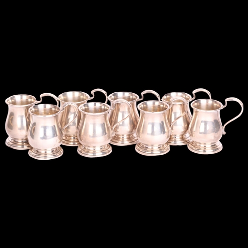 2662 - A cased set of 8 George V novelty silver miniature tankard drinking tots, Adie Brothers Ltd, Birming... 