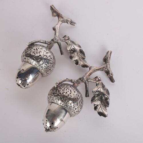 2667 - **CONDITION REPORT CHANGE** A pair of Victorian novelty silver 'Acorn' table pepperettes, Hukin & He... 