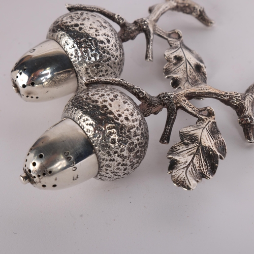 2667 - **CONDITION REPORT CHANGE** A pair of Victorian novelty silver 'Acorn' table pepperettes, Hukin & He... 