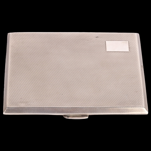 2696 - An Elizabeth II silver cigarette case, WT Toghill & Co, Birmingham 1956, rectangular form with allov... 