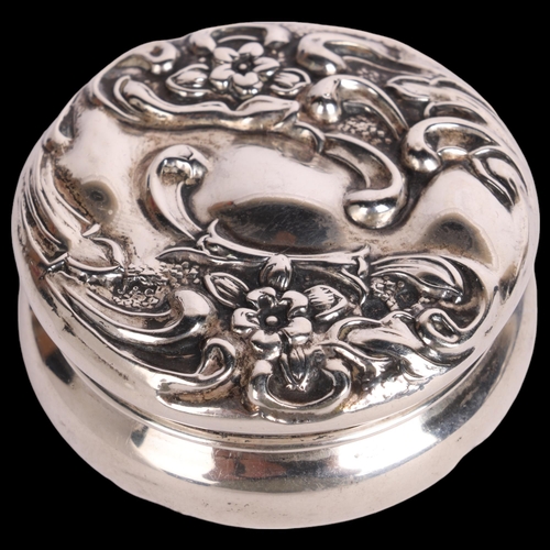 2697 - An Art Nouveau Edwardian silver pillbox, Jones & Crompton Birmingham 1909, circular form with relief... 