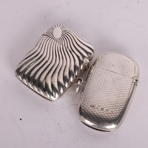 2701 - 2 silver Vesta cases, including relief embossed sunburst example, 5cm x 4cm (2)