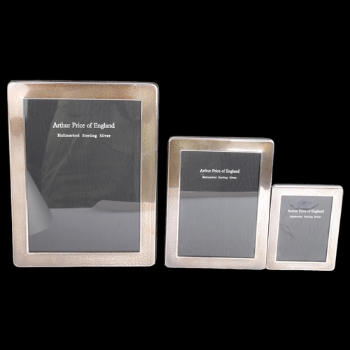 2707 - A graduated set of 3 Elizabeth II silver-fronted rectangular photo frames, Arthur Price, London 1999... 