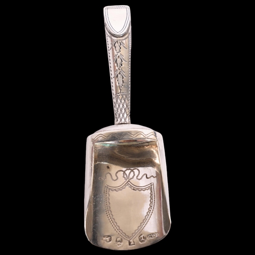 2715 - A George III silver shovel tea caddy spoon, indistinct maker, Birmingham 1804, bright-cut engraved d... 