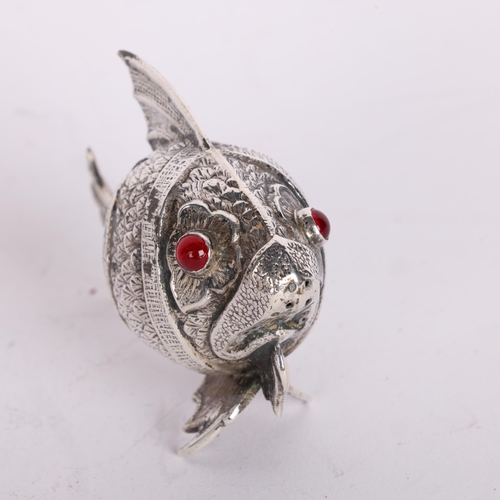 2721 - A Spanish novelty silver fish pepperette, relief embossed decoration with red glass eyes and pentagr... 