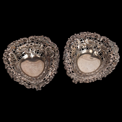 2748 - A pair of late Victorian silver heart bon bon dishes, William Comyns & Sons Ltd, London 1893, relief... 