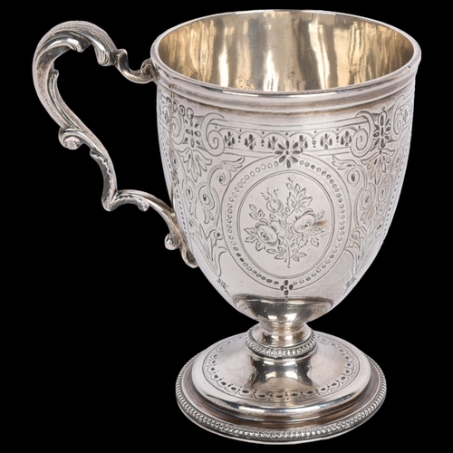 2753 - A Victorian silver christening mug, William Evans, London 1869, bright-cut engraved decoration, with... 