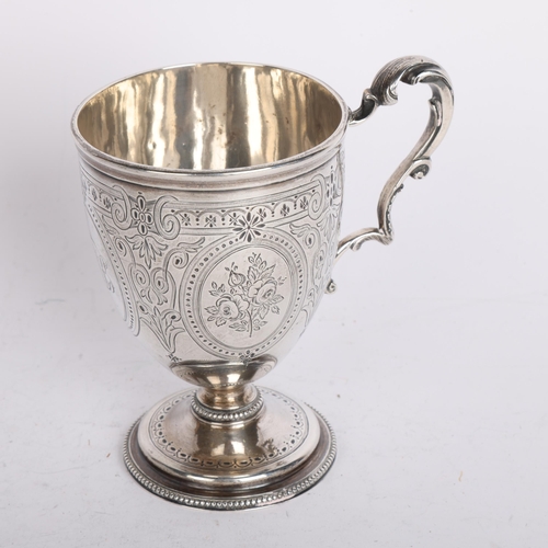 2753 - A Victorian silver christening mug, William Evans, London 1869, bright-cut engraved decoration, with... 