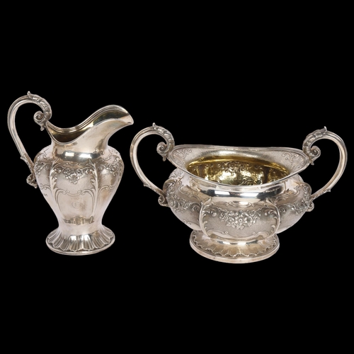 2762 - A George IV silver pumpkin sugar bowl and cream jug set, Benjamin Smith, London 1830, relief embosse... 