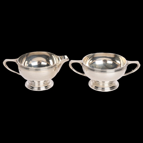 2764 - A George VI silver sugar bowl and cream jug set, Mappin & Webb, Sheffield 1942, jug height 6.5cm, 13... 