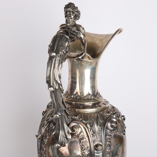 2766 - A large and impressive Italian 800 silver Rococo Revival wine ewer and stand, with Bacchanalian figu... 