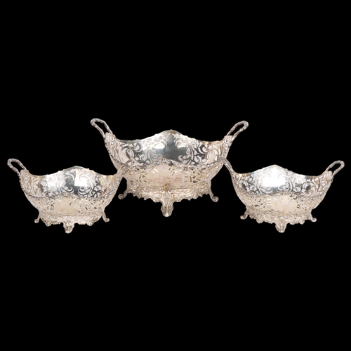 2770 - An impressive set of 3 George V silver 2-handled table centre baskets, Mappin & Webb limited, London... 