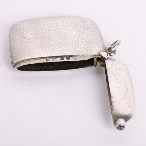 2688A - An Art Deco Continental 800 silver planished Vesta case, with cabochon sapphire thumbpiece, 4.5cm x ... 