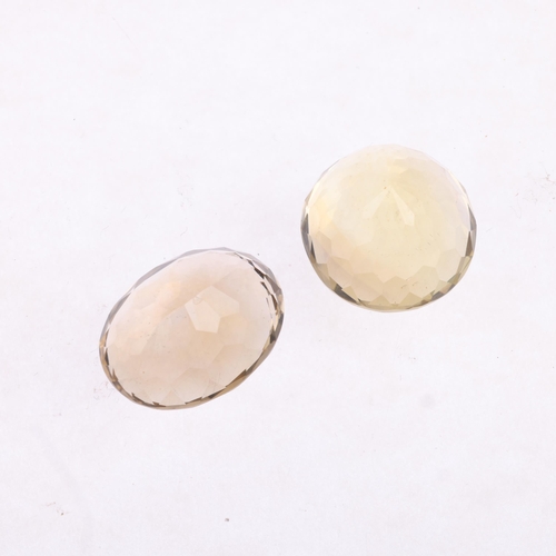 2632 - 2 unmounted gemstones, comprising round-cut citrine, 16.8 x 13.3mm, and oval smoky quartz, 18.7 x 14... 