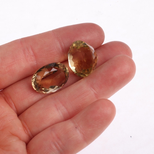 2632 - 2 unmounted gemstones, comprising round-cut citrine, 16.8 x 13.3mm, and oval smoky quartz, 18.7 x 14... 