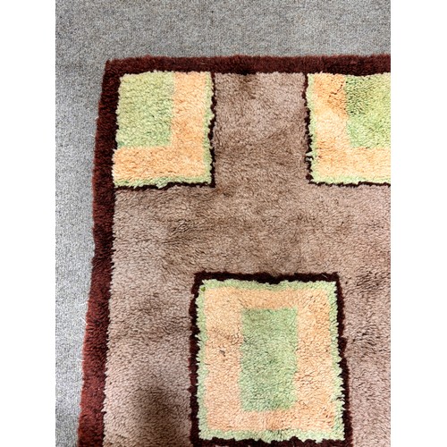 317 - A 1930s Art Deco modernist hand tufted rug, 130 x 70cm