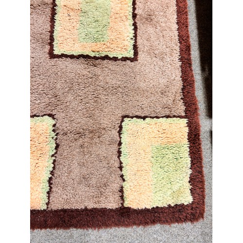 317 - A 1930s Art Deco modernist hand tufted rug, 130 x 70cm