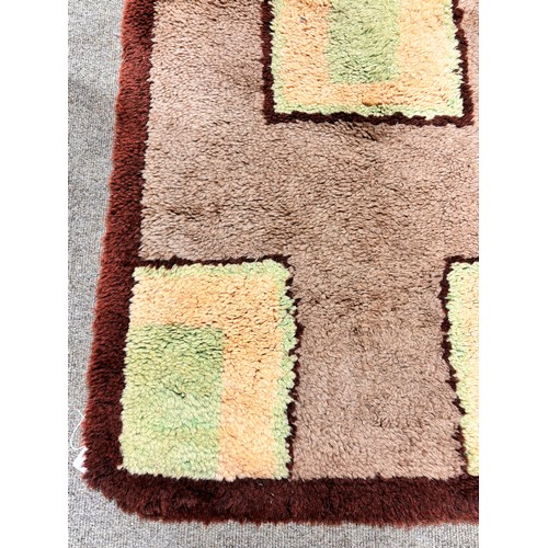 317 - A 1930s Art Deco modernist hand tufted rug, 130 x 70cm