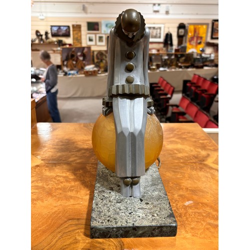 86 - Art Deco aluminium and brass Pierrot clown design table lamp, with amber glass ball shade and marble... 