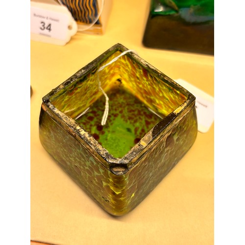 36 - Loetz iridescent green glass box, hinged brass cover with impressed holly leaf design, width 7.5cm