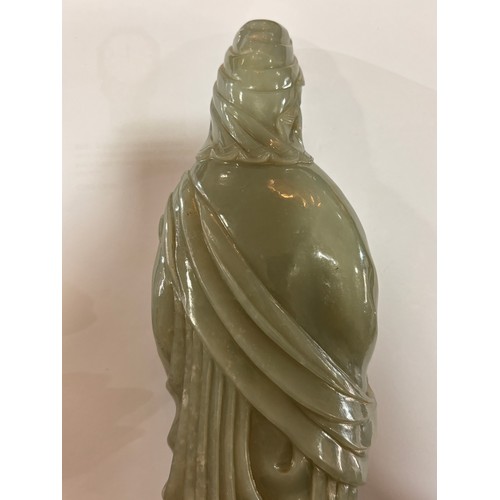 782 - A Chinese carved green jade figure of Guanyin on carved hardwood stand, overall height 32cm, provena... 