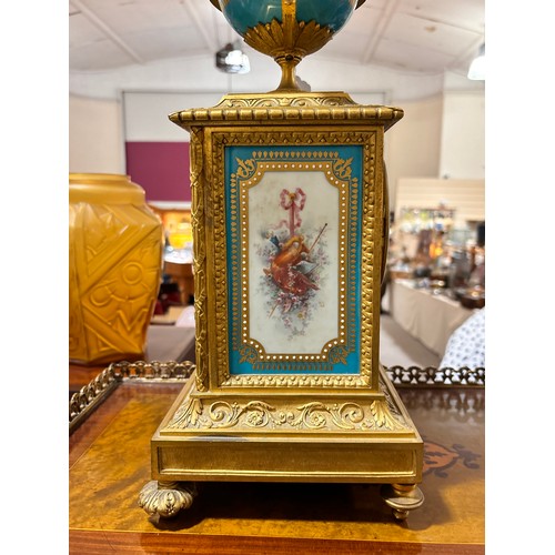 888 - A fine 19th century gilt-bronze and porcelain 8-day mantel clock, with hand painted panels depicting... 