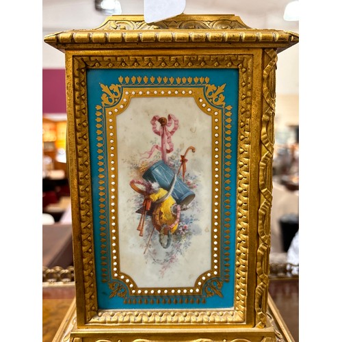 888 - A fine 19th century gilt-bronze and porcelain 8-day mantel clock, with hand painted panels depicting... 