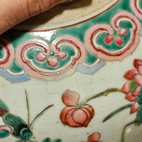 784 - A Chinese 19th century famille rose porcelain jar and cover, with painted enamel insects and flowers... 