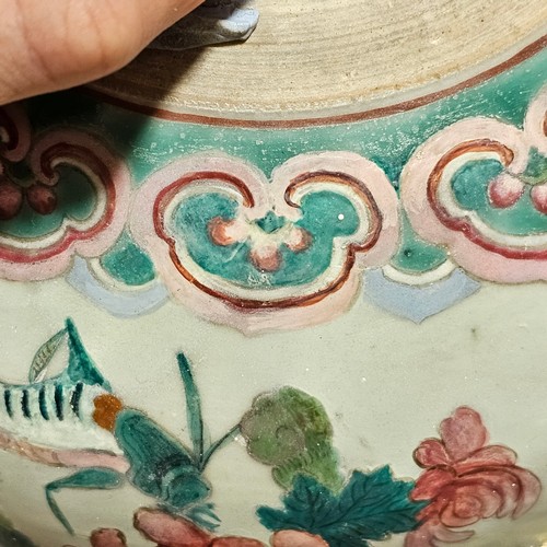 784 - A Chinese 19th century famille rose porcelain jar and cover, with painted enamel insects and flowers... 