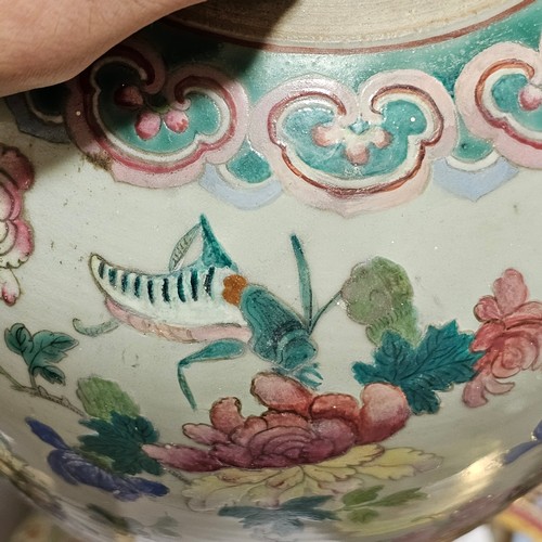 784 - A Chinese 19th century famille rose porcelain jar and cover, with painted enamel insects and flowers... 