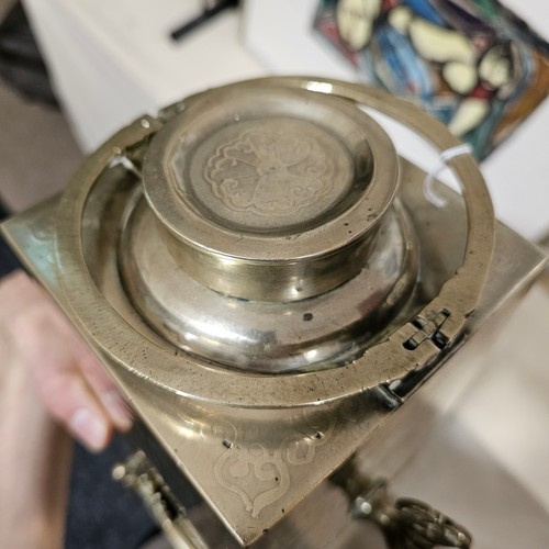 825 - A Chinese square-section tea urn on burner stand, nickel plate on brass with relief moulded insect d... 