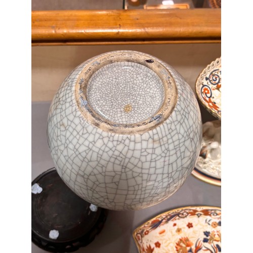 785 - A Chinese crackle glaze porcelain onion-shaped vase on carved wood stand, overall height 39cm