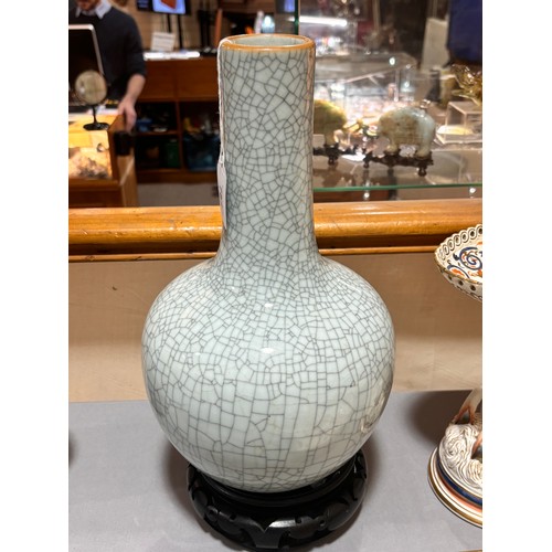 785 - A Chinese crackle glaze porcelain onion-shaped vase on carved wood stand, overall height 39cm