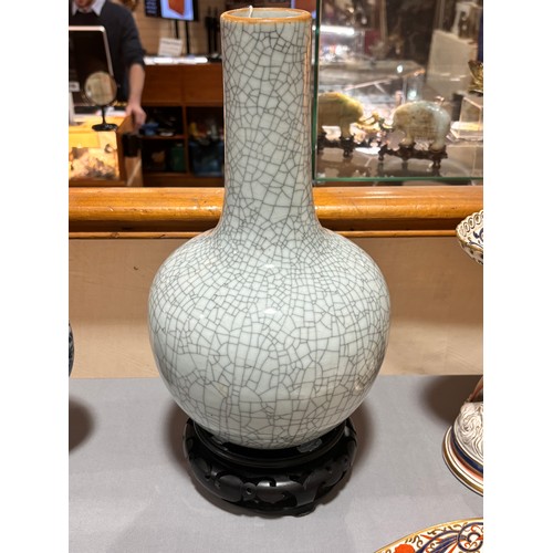 785 - A Chinese crackle glaze porcelain onion-shaped vase on carved wood stand, overall height 39cm