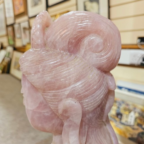 851 - A massive Chinese rose quartz figure of Guanyin holding a Rui sceptre, height 71cm