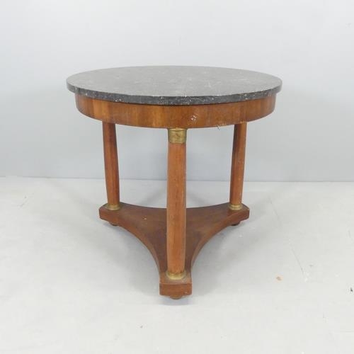 2017 - A French mahogany marble-topped Gueridon / centre table, raised on three turned legs with platform b... 