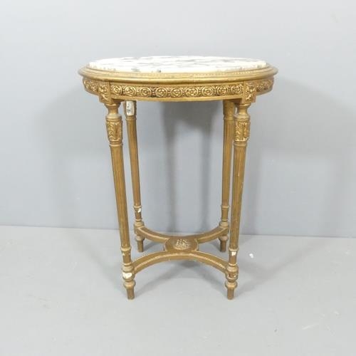 2018 - A French oval marble-topped occasional table, on gilt painted base, with carved and fluted decoratio... 